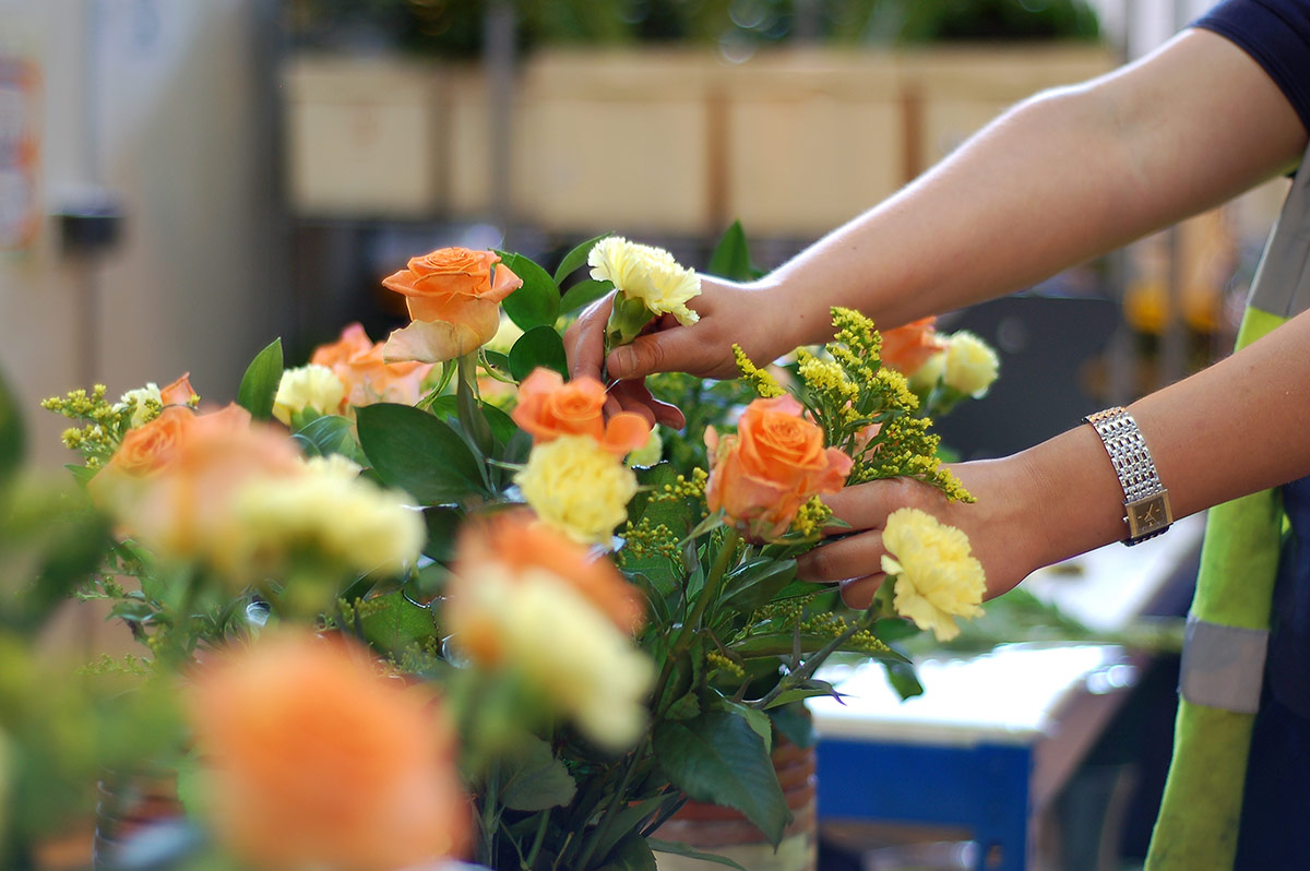 corporate flowers experts preparing corporate gifts for delivery